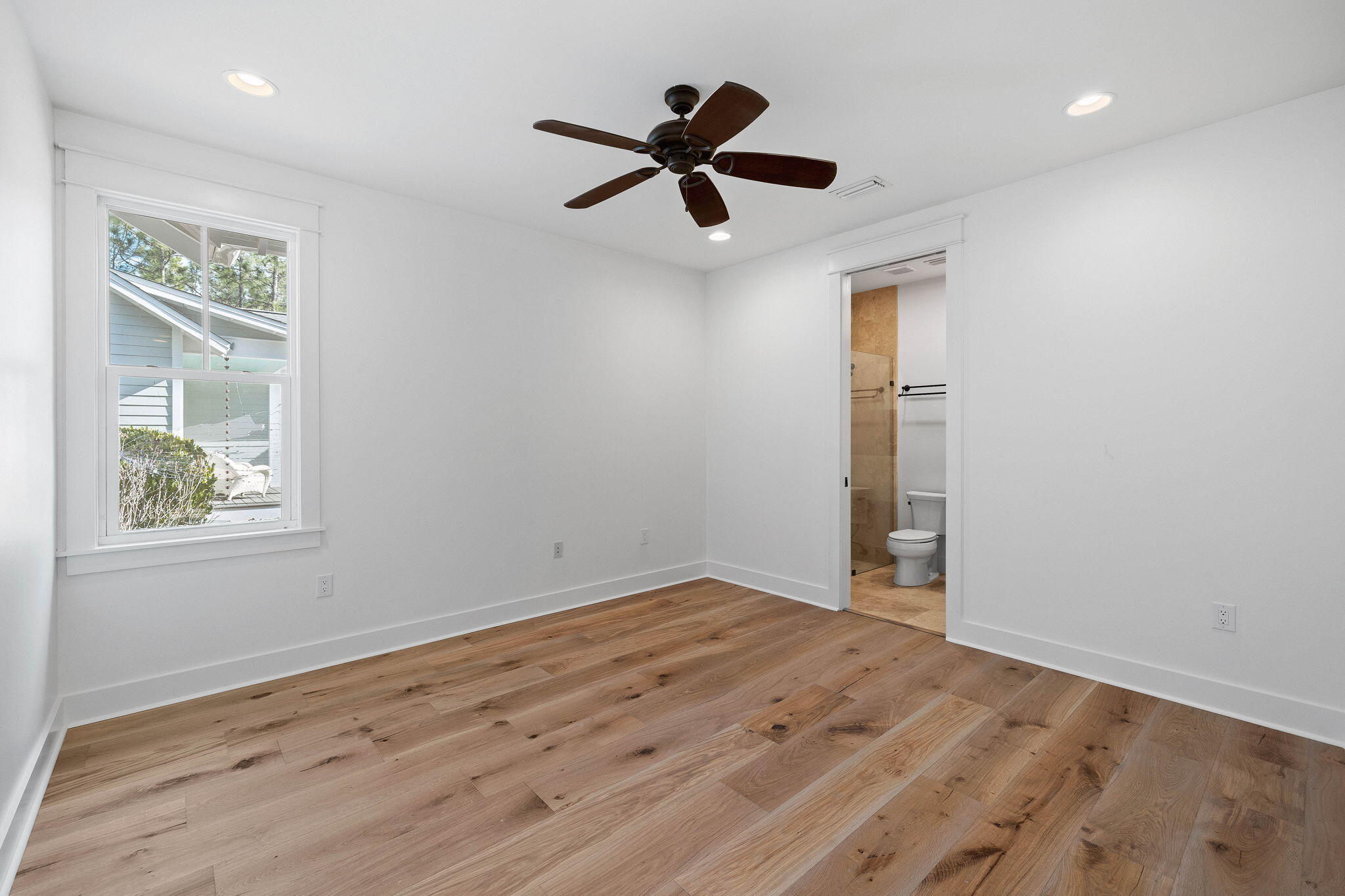 821 Breakers Street Inlet Beach, FL 32461 - Photo 42 of 69 wooden floor in an empty room with a window