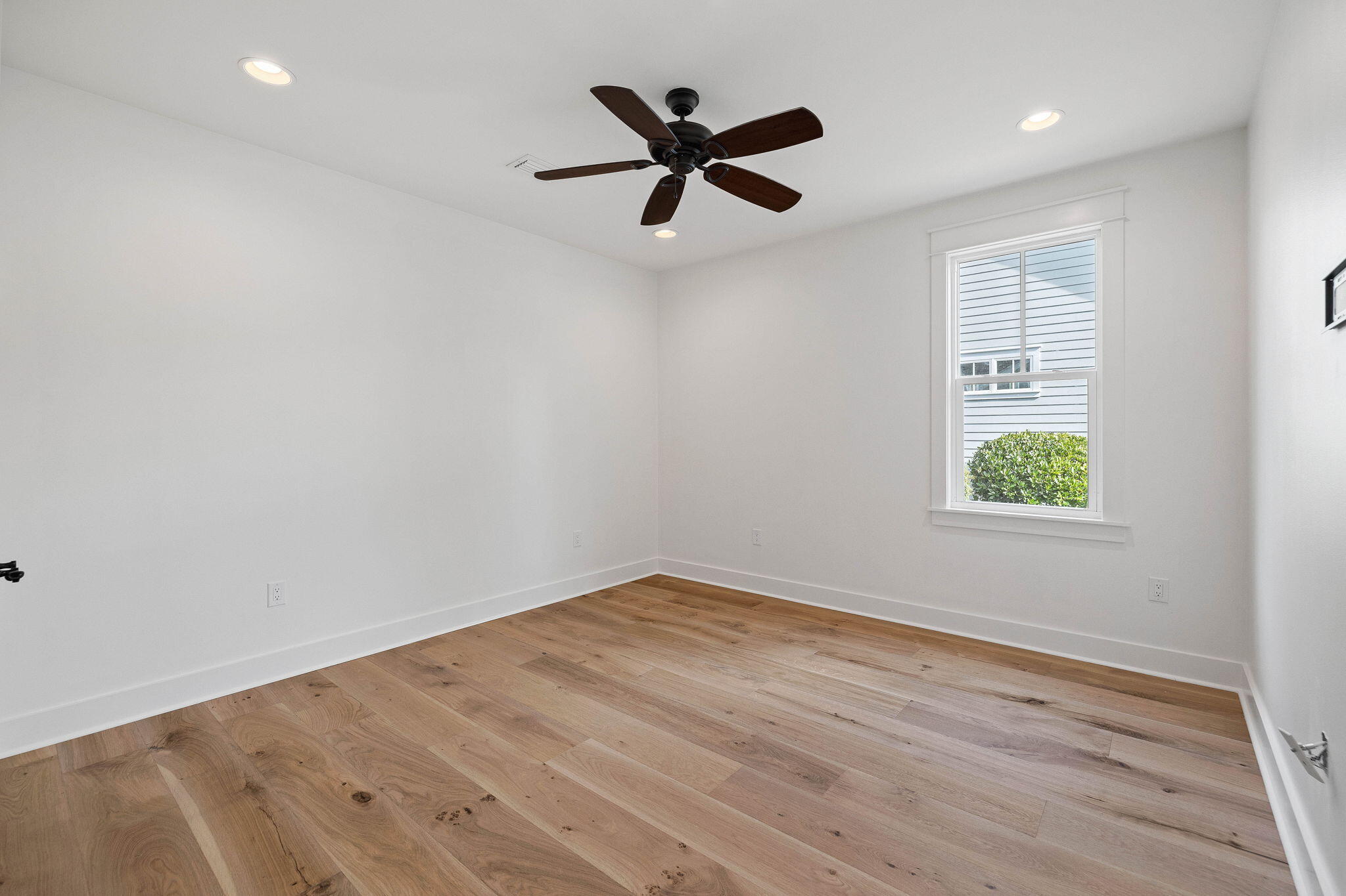 821 Breakers Street Inlet Beach, FL 32461 - Photo 45 of 69 wooden floor in an empty room with a window