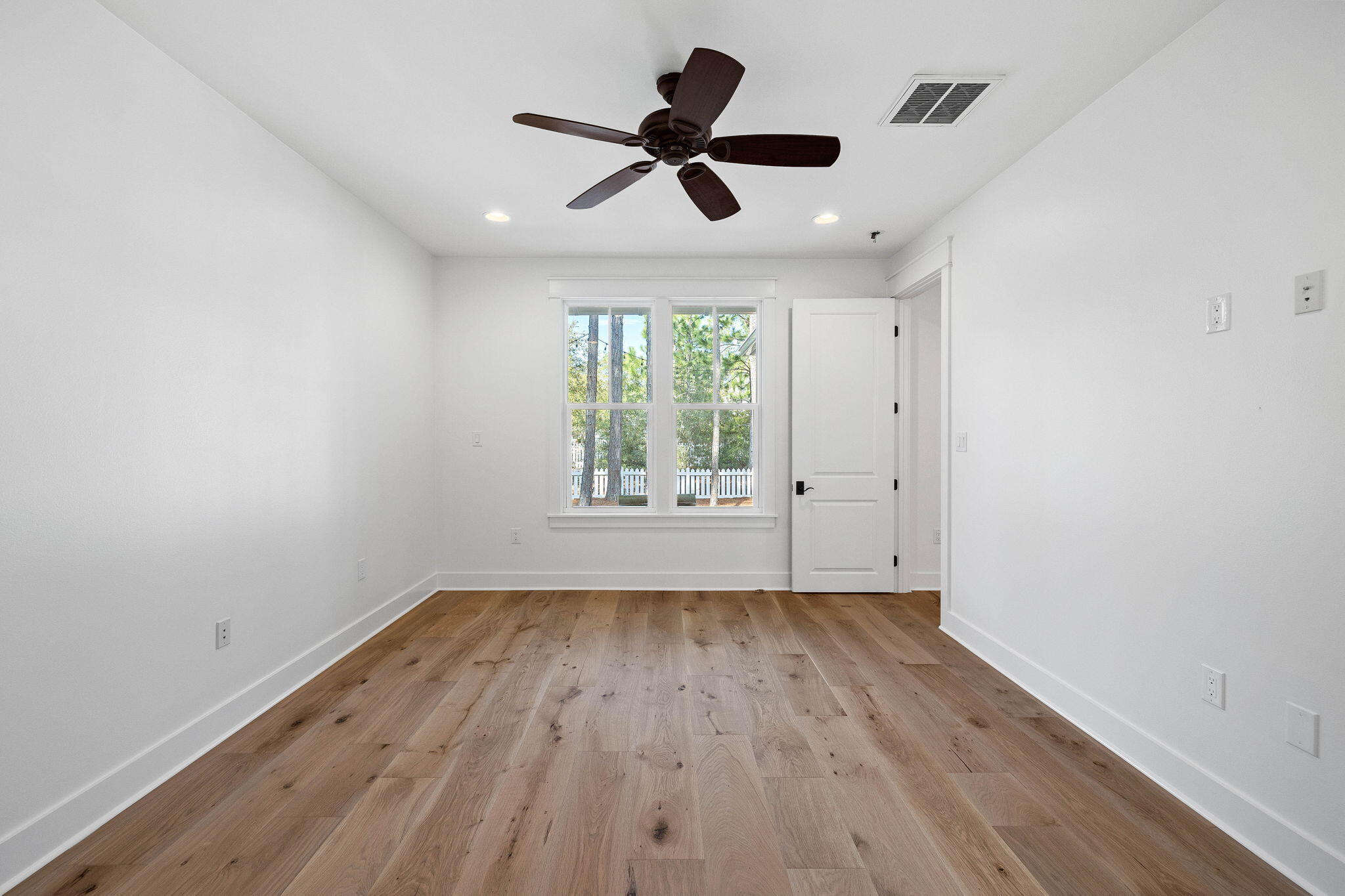 821 Breakers Street Inlet Beach, FL 32461 - Photo 54 of 69 wooden floor in an empty room with a window