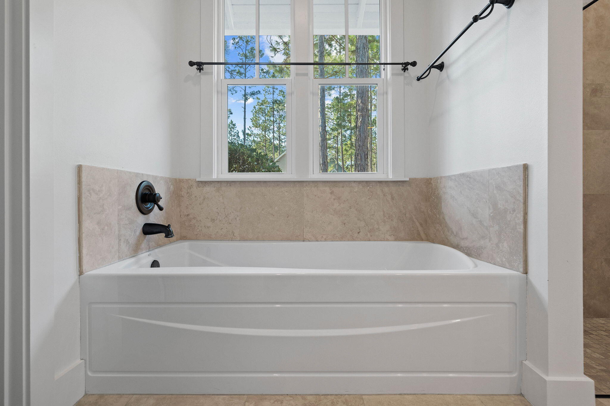 821 Breakers Street Inlet Beach, FL 32461 - Photo 58 of 69 a bathroom with a bathtub and a window