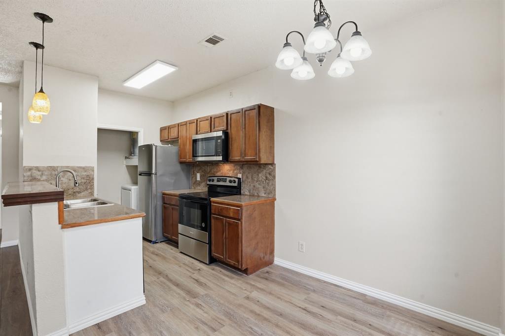 4101 Esters Road, Unit 101 Irving, TX 75038 - Photo 5 of 24 Remodeled kitchen with granite counters & new appliances