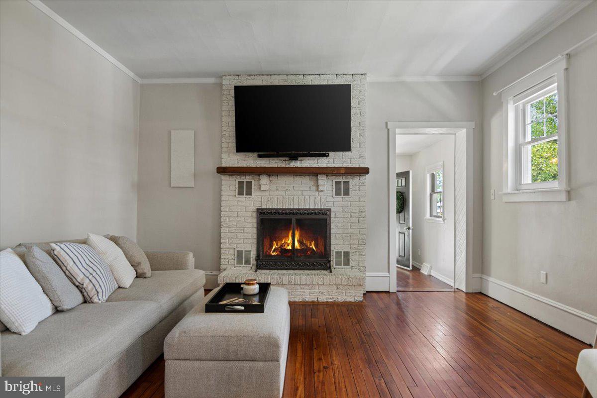 158 Lafayette Road Audubon, NJ 08106 - Photo 9 of 29 Cozy living space with a warm fireplace.