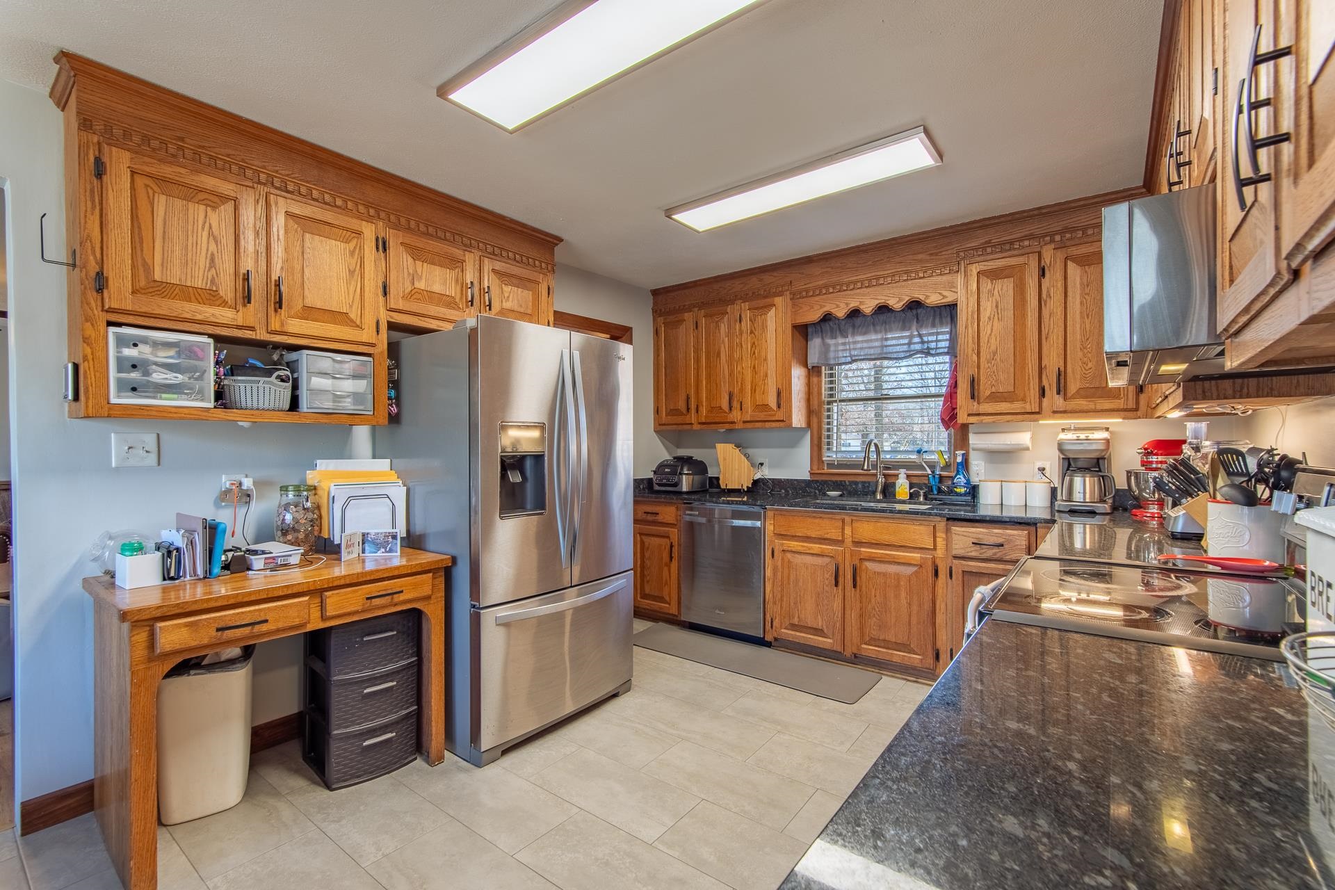 255 Easley Loop Savannah, TN 38372 - Photo 11 of 40 a kitchen with stainless steel appliances granite countertop a refrigerator a stove and a sink dishwasher