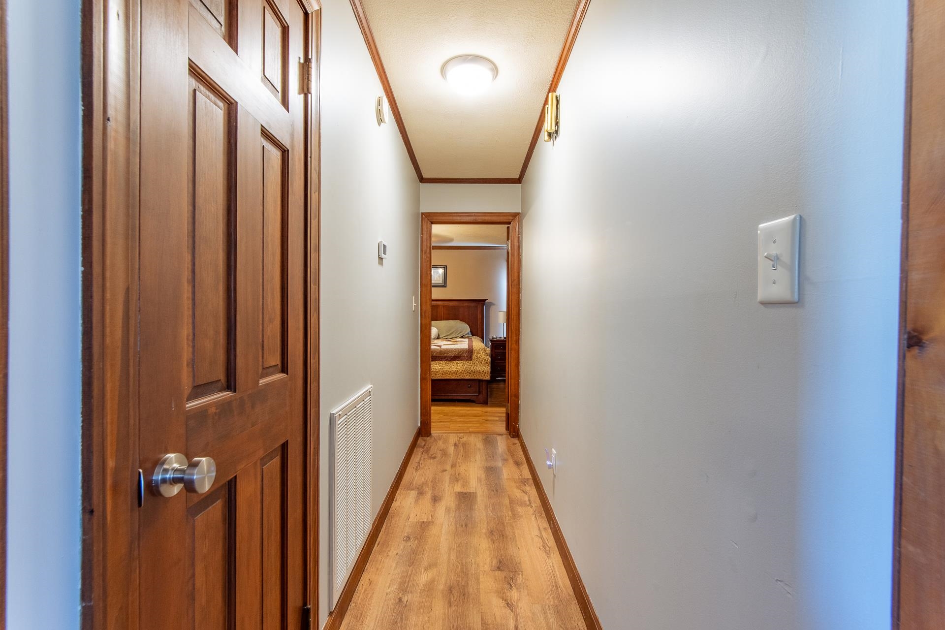 255 Easley Loop Savannah, TN 38372 - Photo 18 of 40 a view of a hallway with wooden floor and staircase