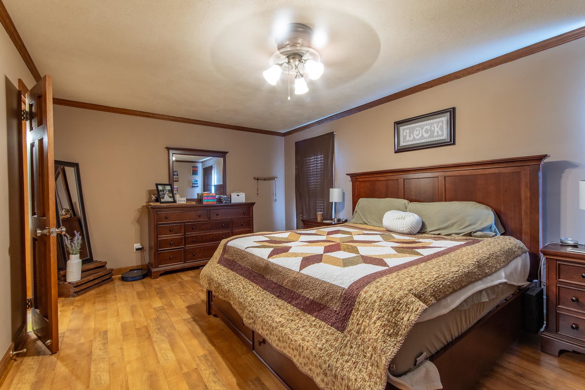 255 Easley Loop Savannah, TN 38372 - Photo 19 of 40 a bedroom with bed and a chandelier