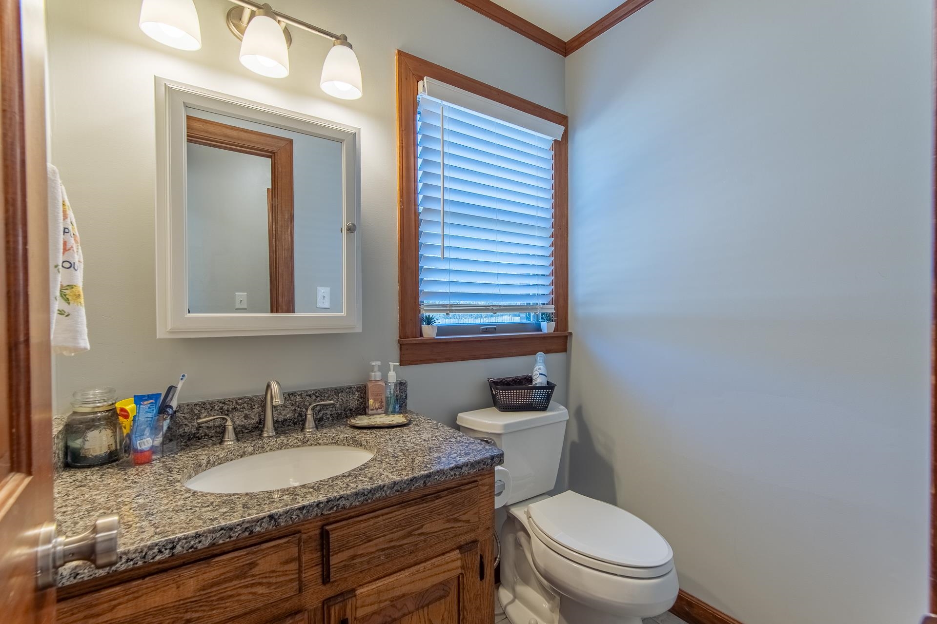 255 Easley Loop Savannah, TN 38372 - Photo 24 of 40 a bathroom with a granite countertop toilet sink and mirror