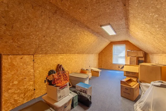 a view of a house with a snow in the yard