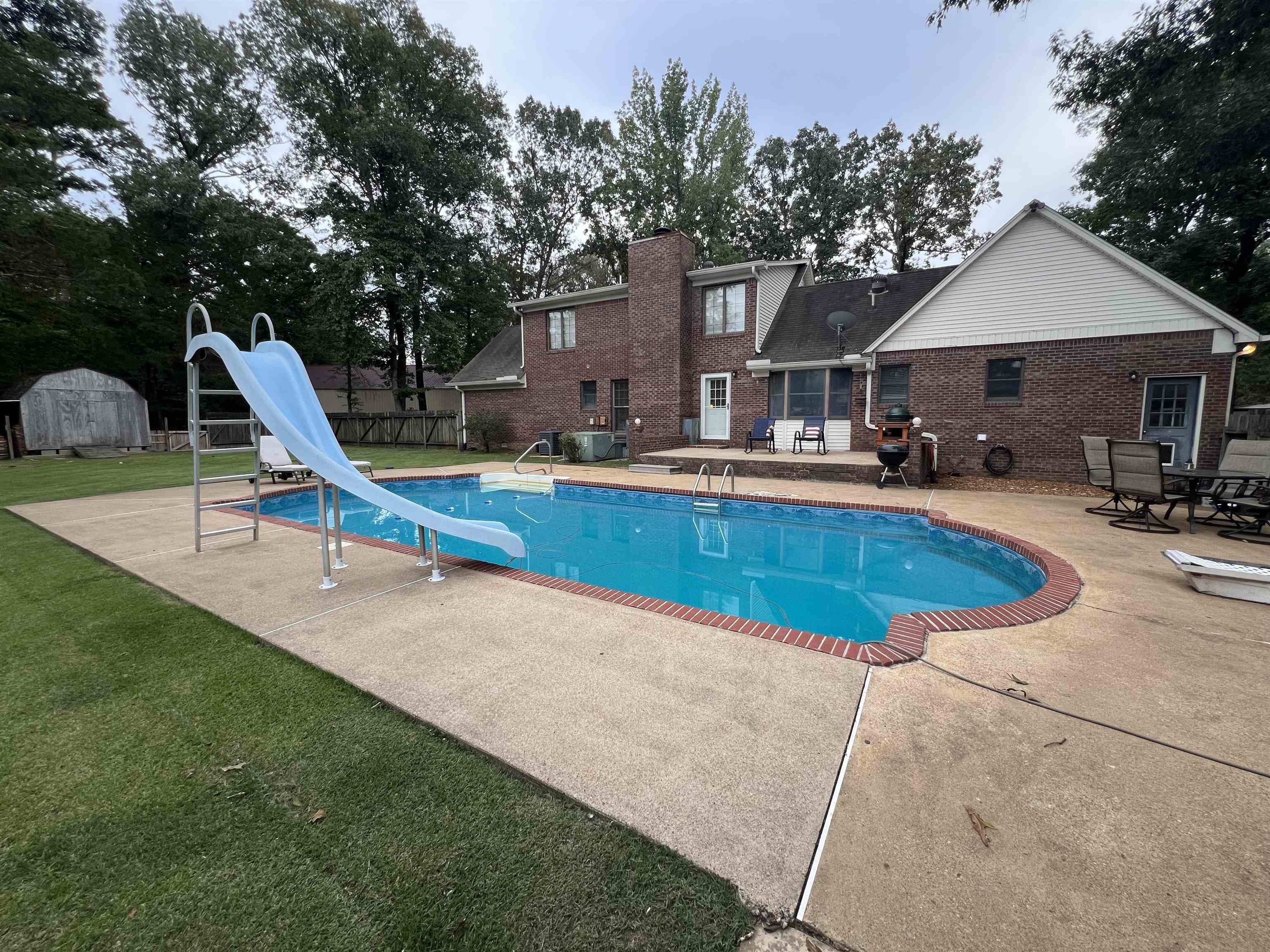 255 Easley Loop Savannah, TN 38372 - Photo 3 of 40 a view of a house with swimming pool and sitting area