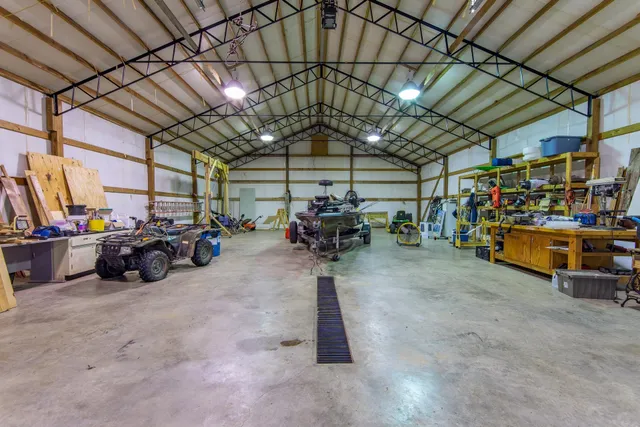 a view of large pool with large trees