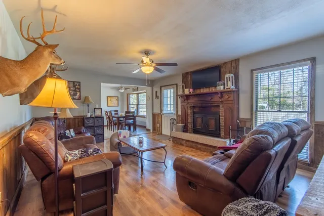 a kitchen with a table chairs refrigerator and cabinets