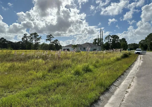 a view of a lake with a big yard