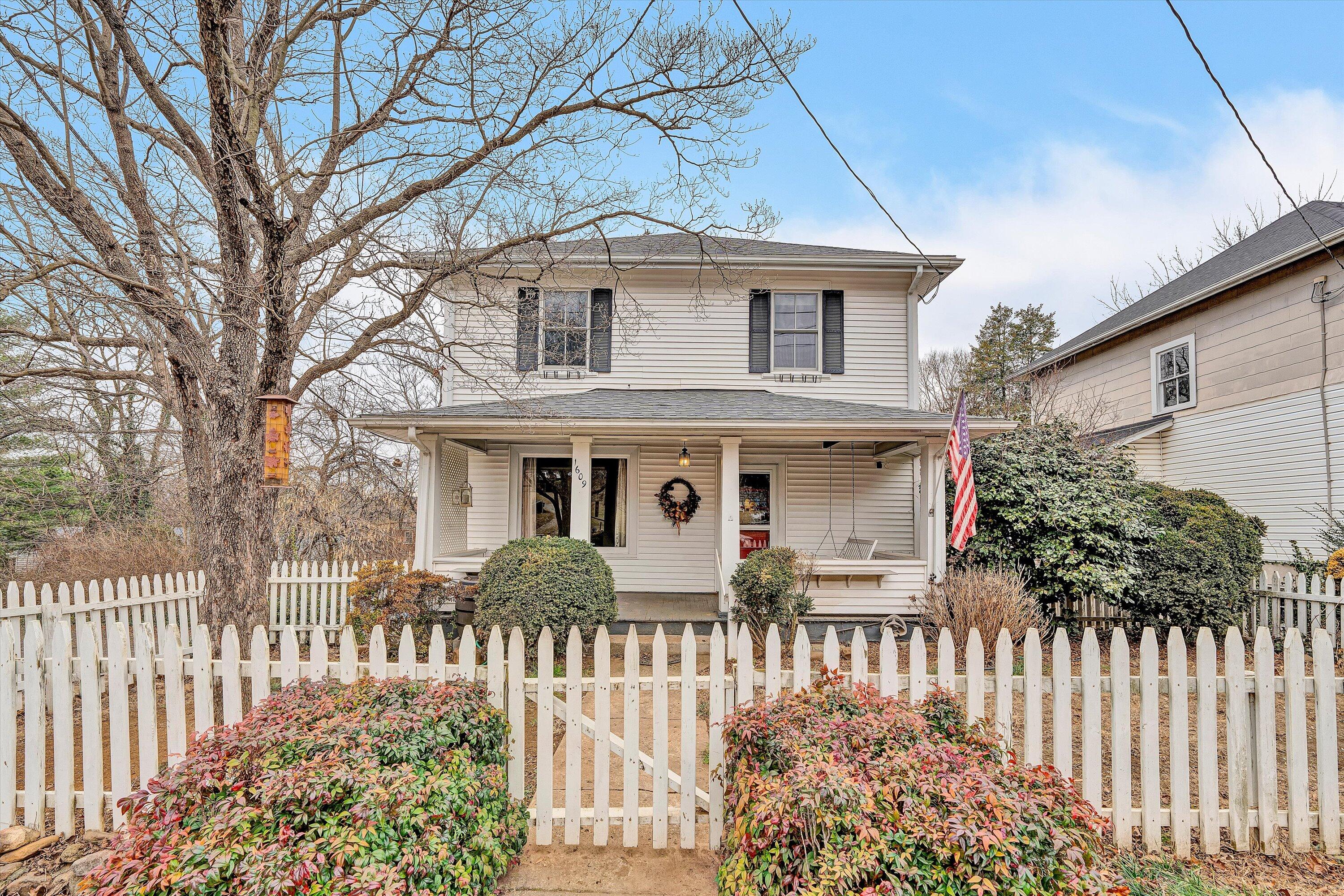 1609 6th Street Southwest Roanoke, VA 24016 - Photo 1 of 43 a front view of a house with a garden