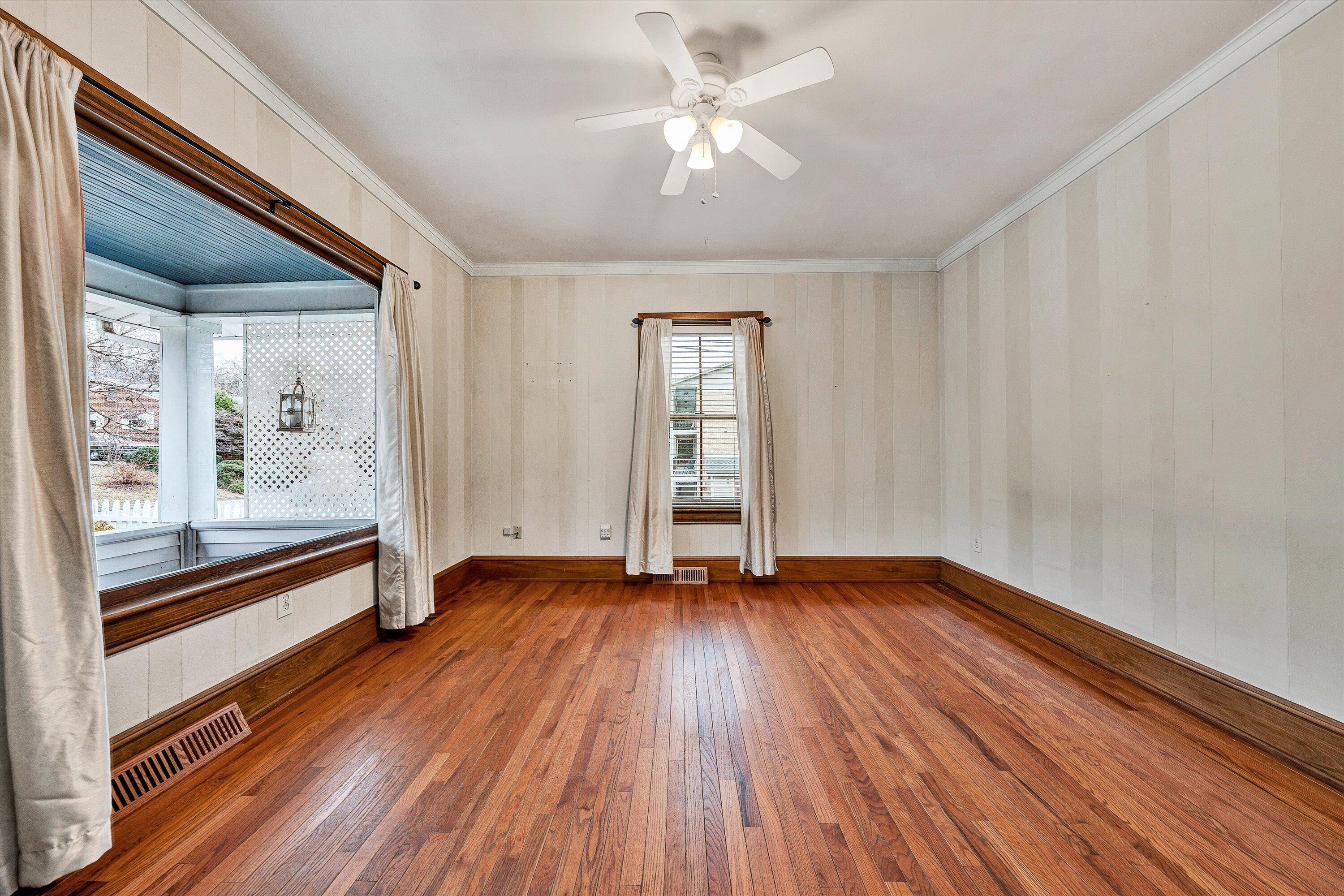 1609 6th Street Southwest Roanoke, VA 24016 - Photo 11 of 43 a view of an empty room window and wooden floor