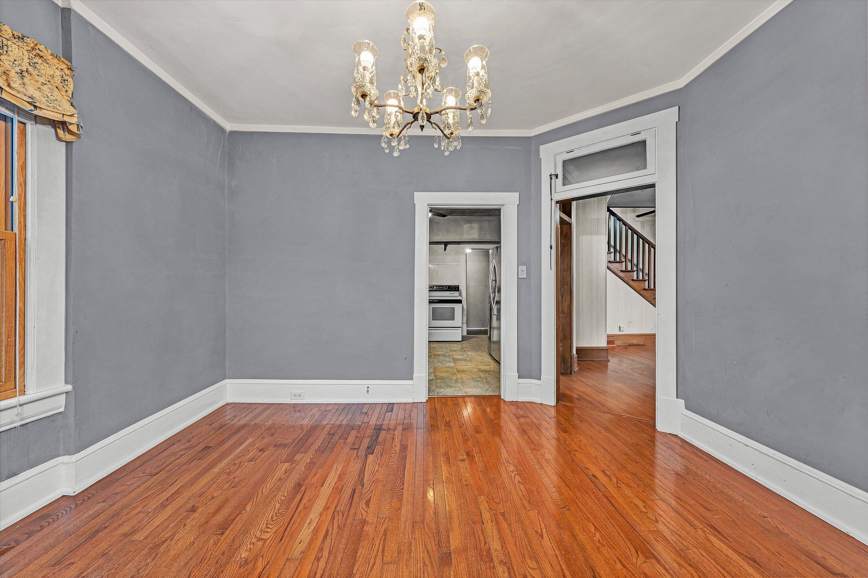 1609 6th Street Southwest Roanoke, VA 24016 - Photo 13 of 43 a view of livingroom with chandelier and wooden floor