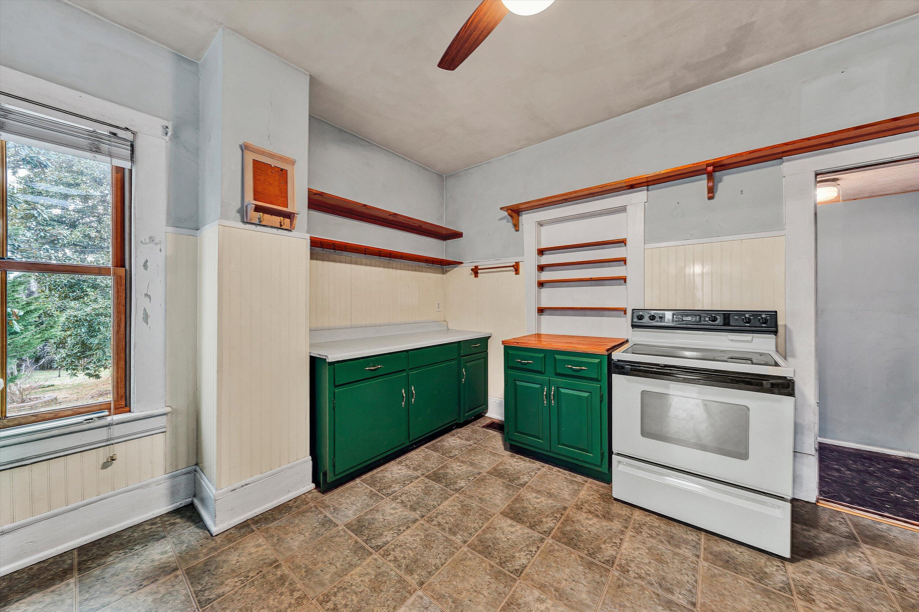 1609 6th Street Southwest Roanoke, VA 24016 - Photo 14 of 43 a kitchen with a sink and a stove top oven