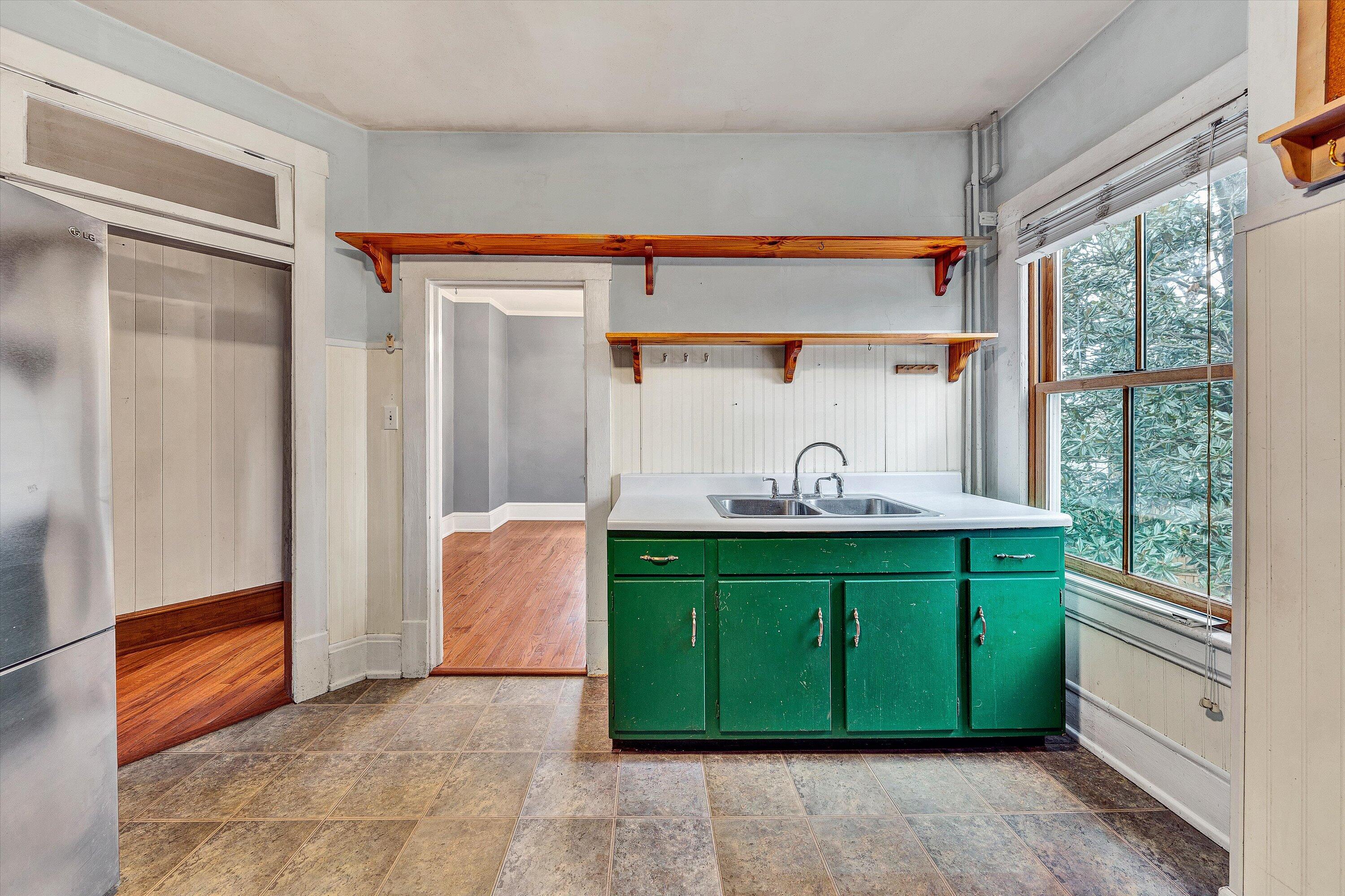 1609 6th Street Southwest Roanoke, VA 24016 - Photo 14 of 43 a bathroom with a sink and a mirror