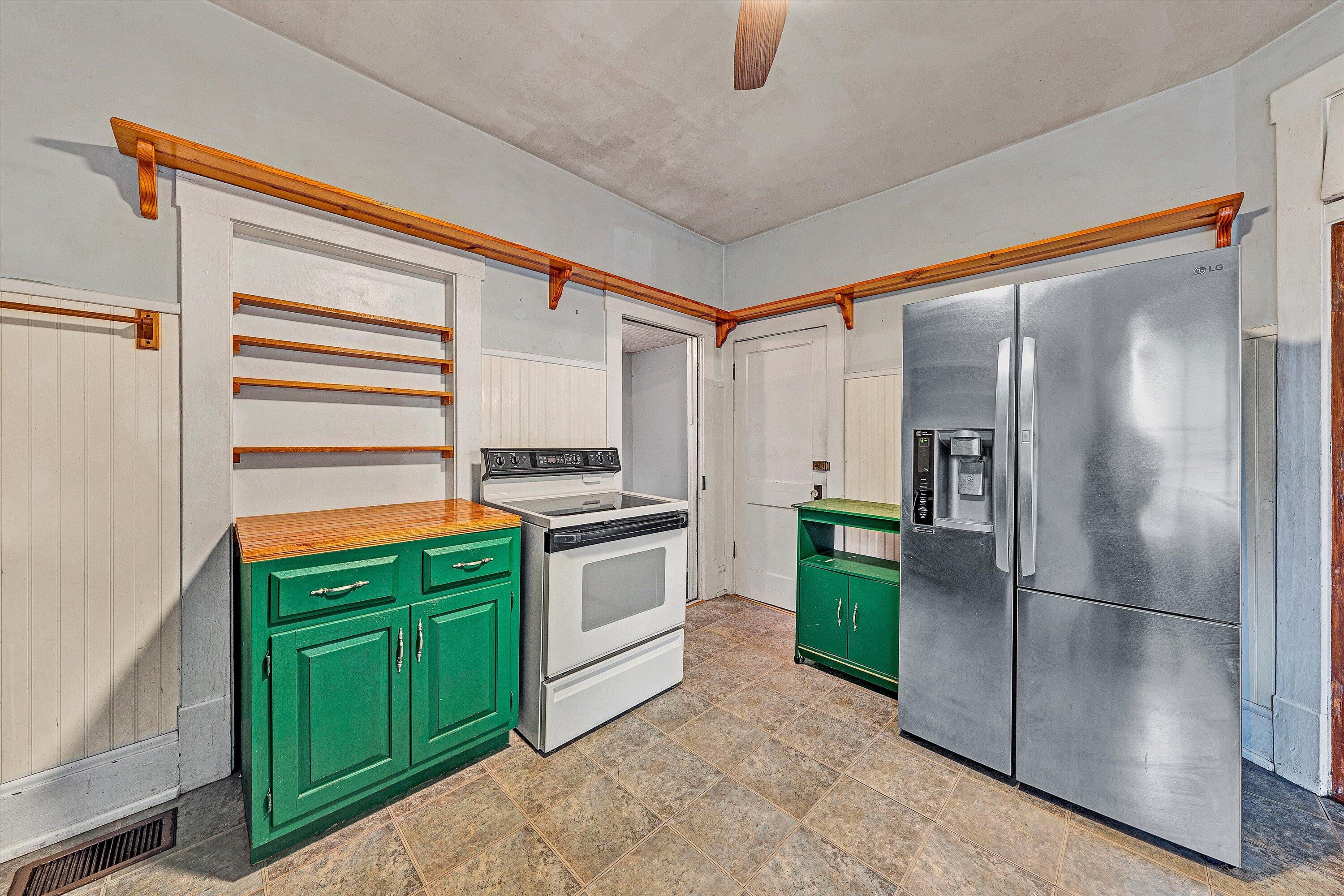 1609 6th Street Southwest Roanoke, VA 24016 - Photo 16 of 43 a kitchen with a refrigerator and a sink
