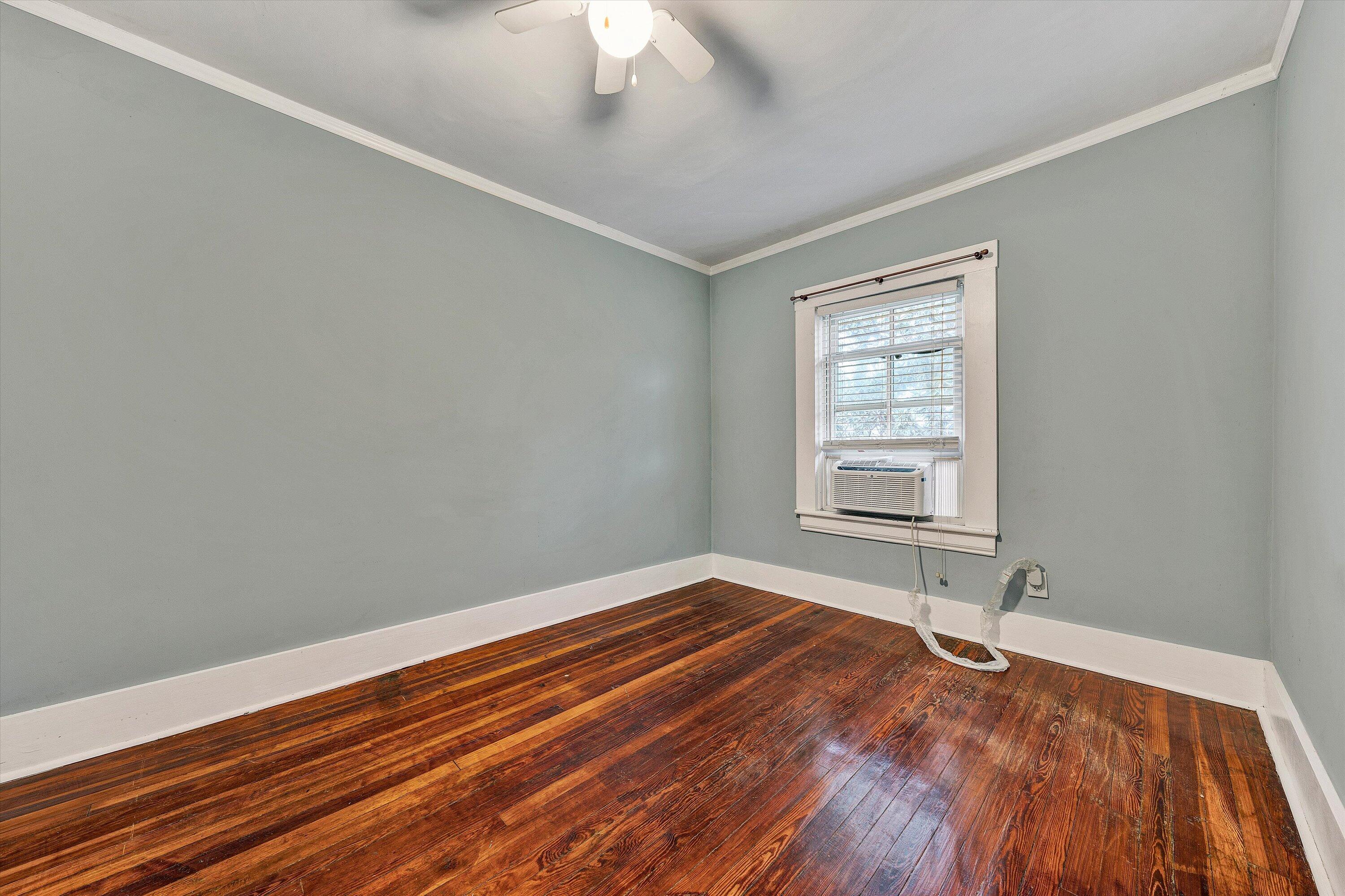 1609 6th Street Southwest Roanoke, VA 24016 - Photo 19 of 43 a view of a room with wooden floor and fan