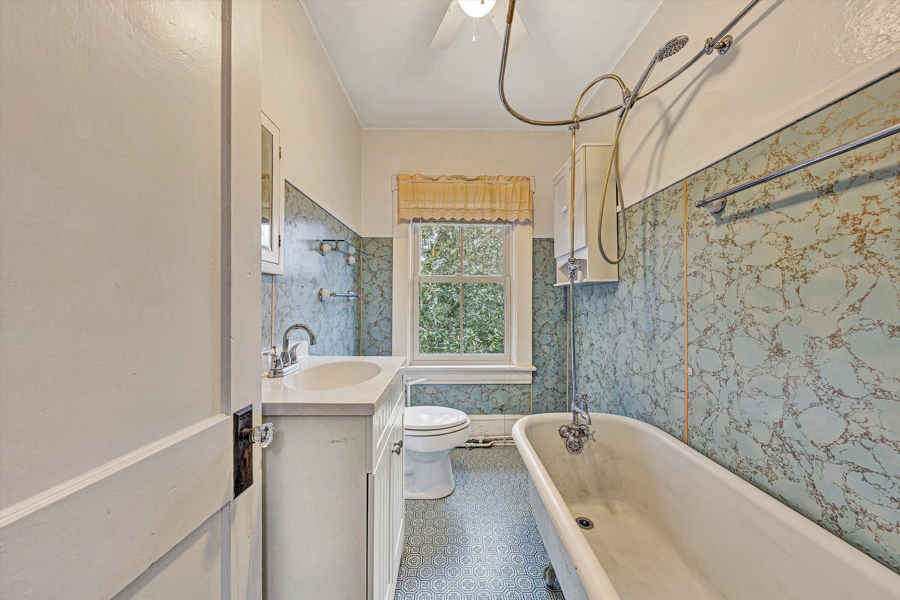 1609 6th Street Southwest Roanoke, VA 24016 - Photo 21 of 43 a bathroom with a sink a toilet and a bathtub