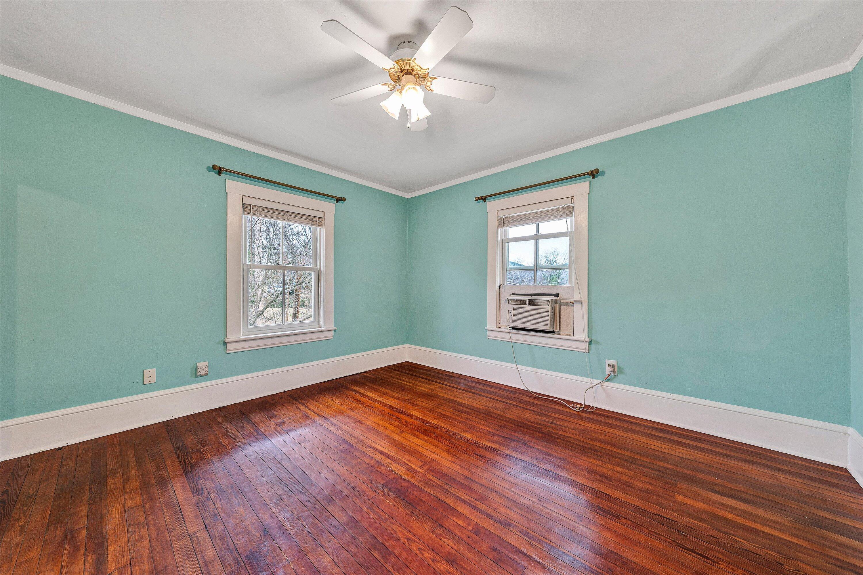 1609 6th Street Southwest Roanoke, VA 24016 - Photo 23 of 43 a view of an empty room with window and wooden floor