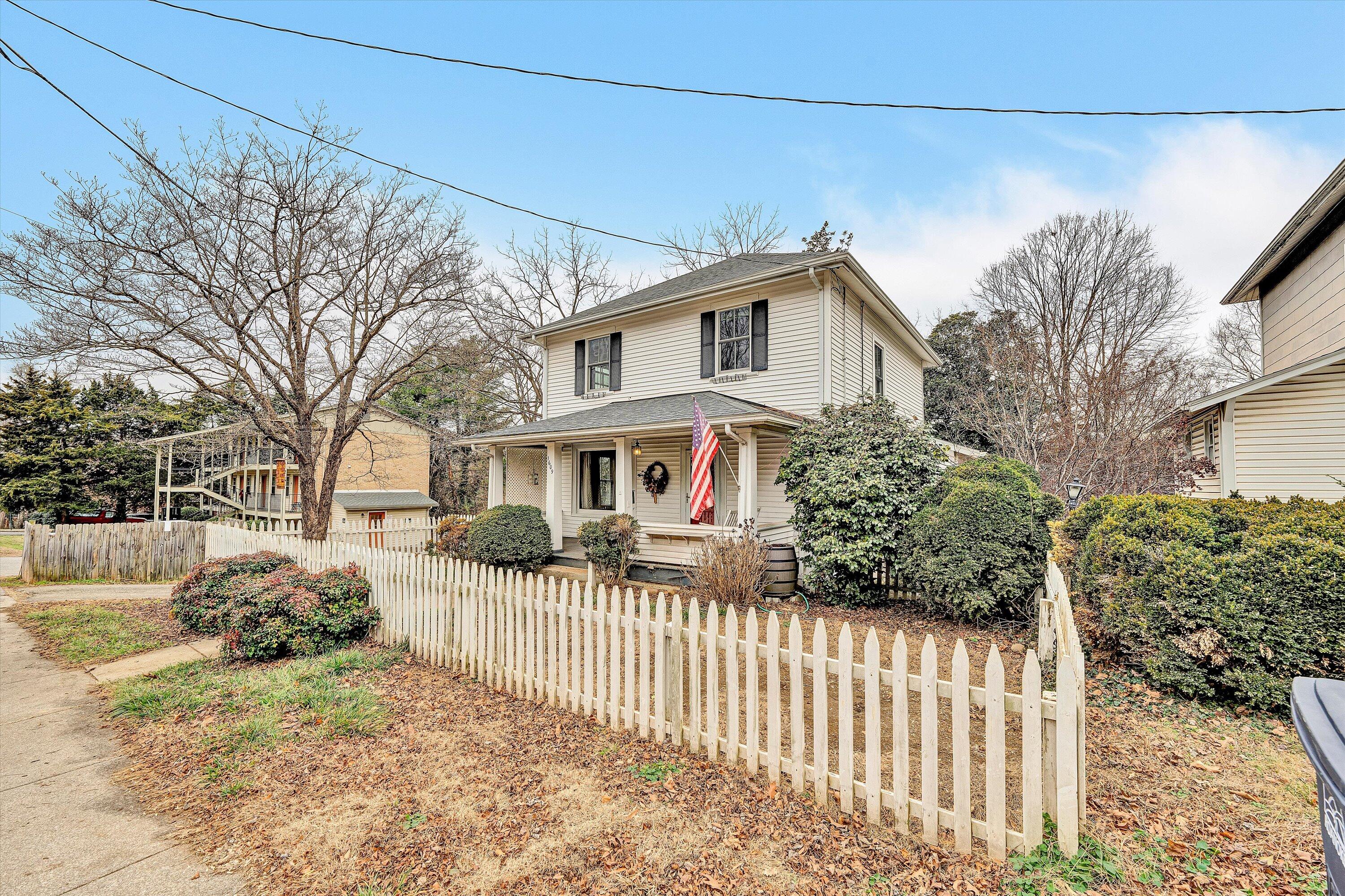 1609 6th Street Southwest Roanoke, VA 24016 - Photo 3 of 43 a front view of a house with a yard