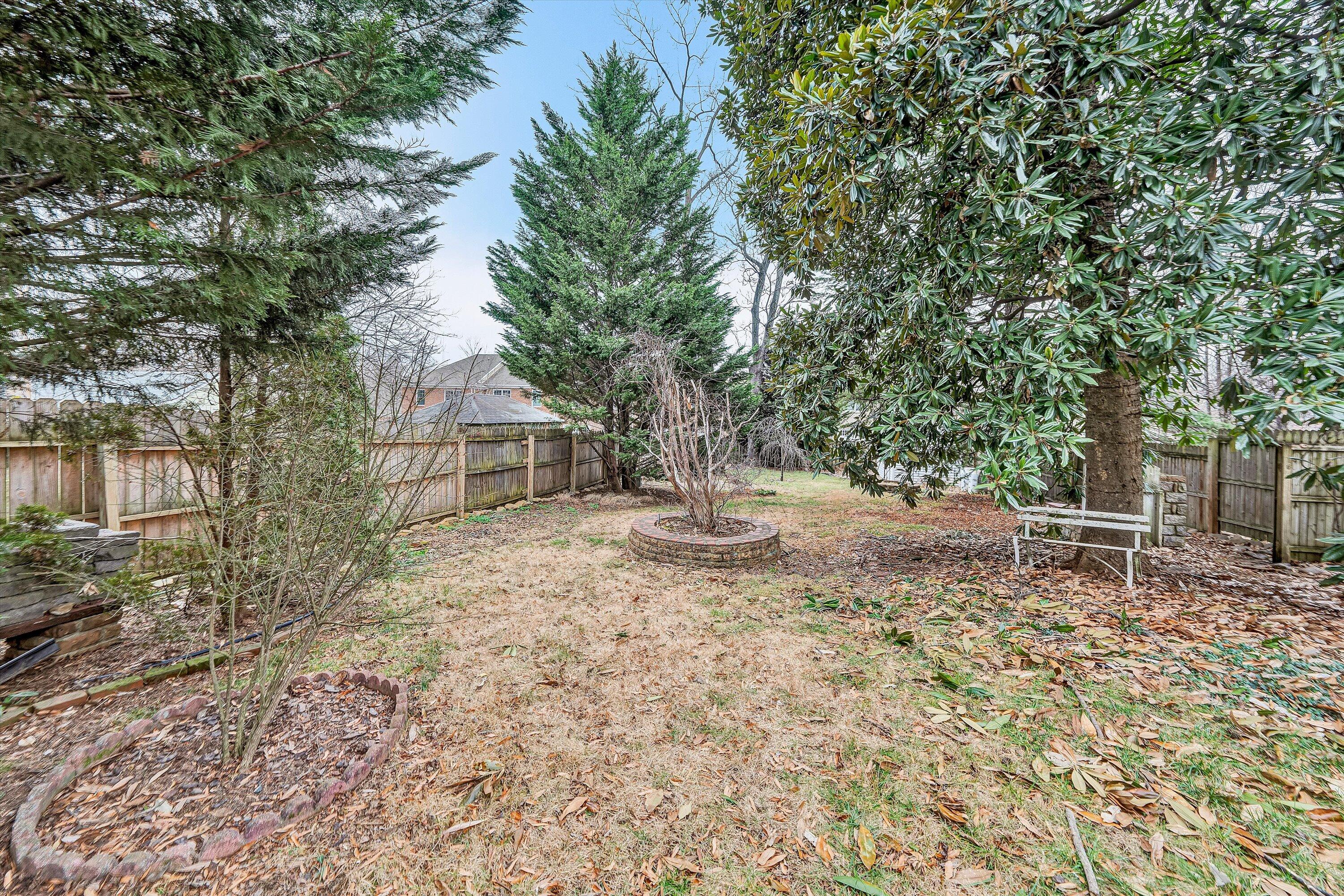 1609 6th Street Southwest Roanoke, VA 24016 - Photo 38 of 43 a view of backyard with table and chairs and wooden fence