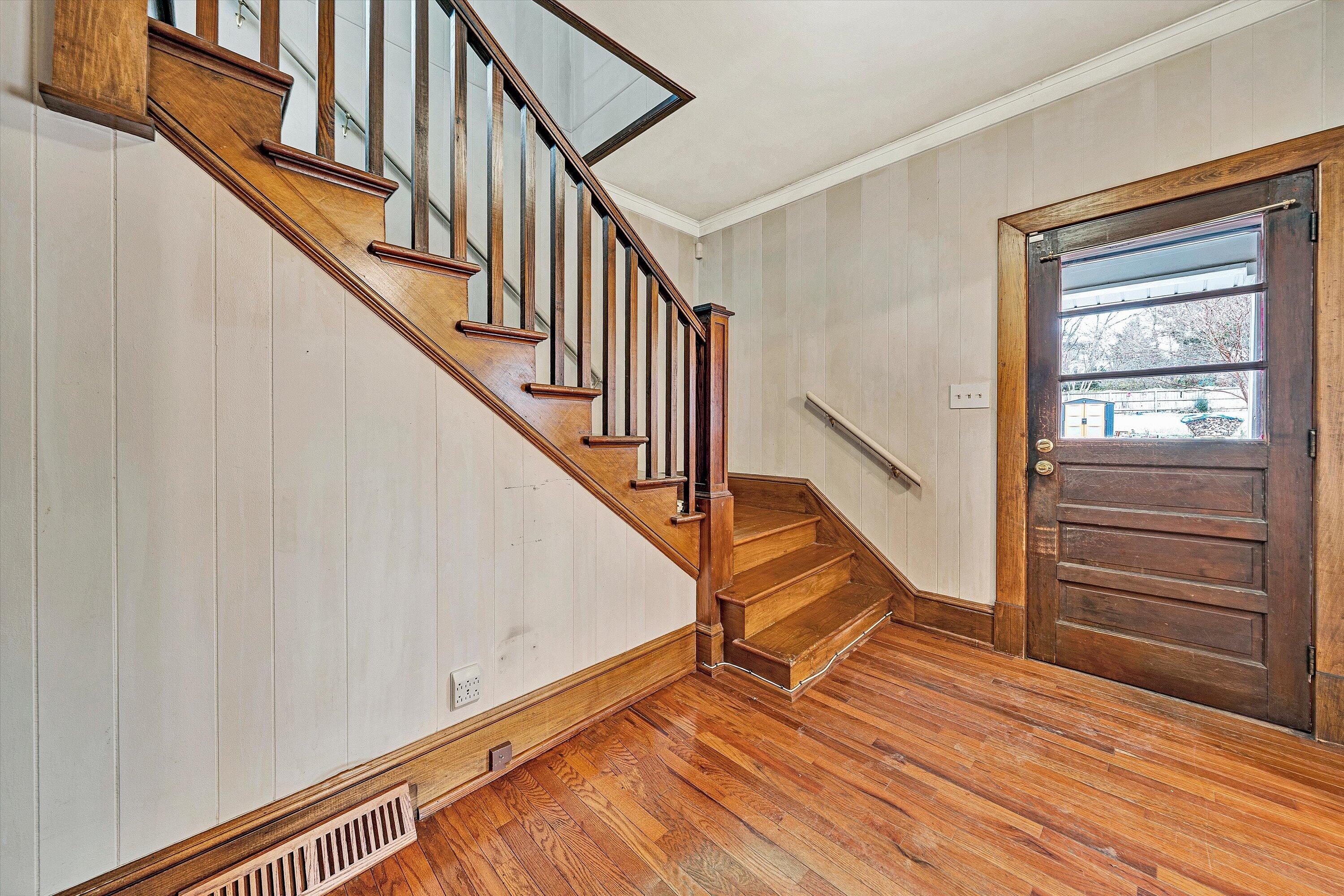 1609 6th Street Southwest Roanoke, VA 24016 - Photo 8 of 43 a view of entryway and hall with wooden floor
