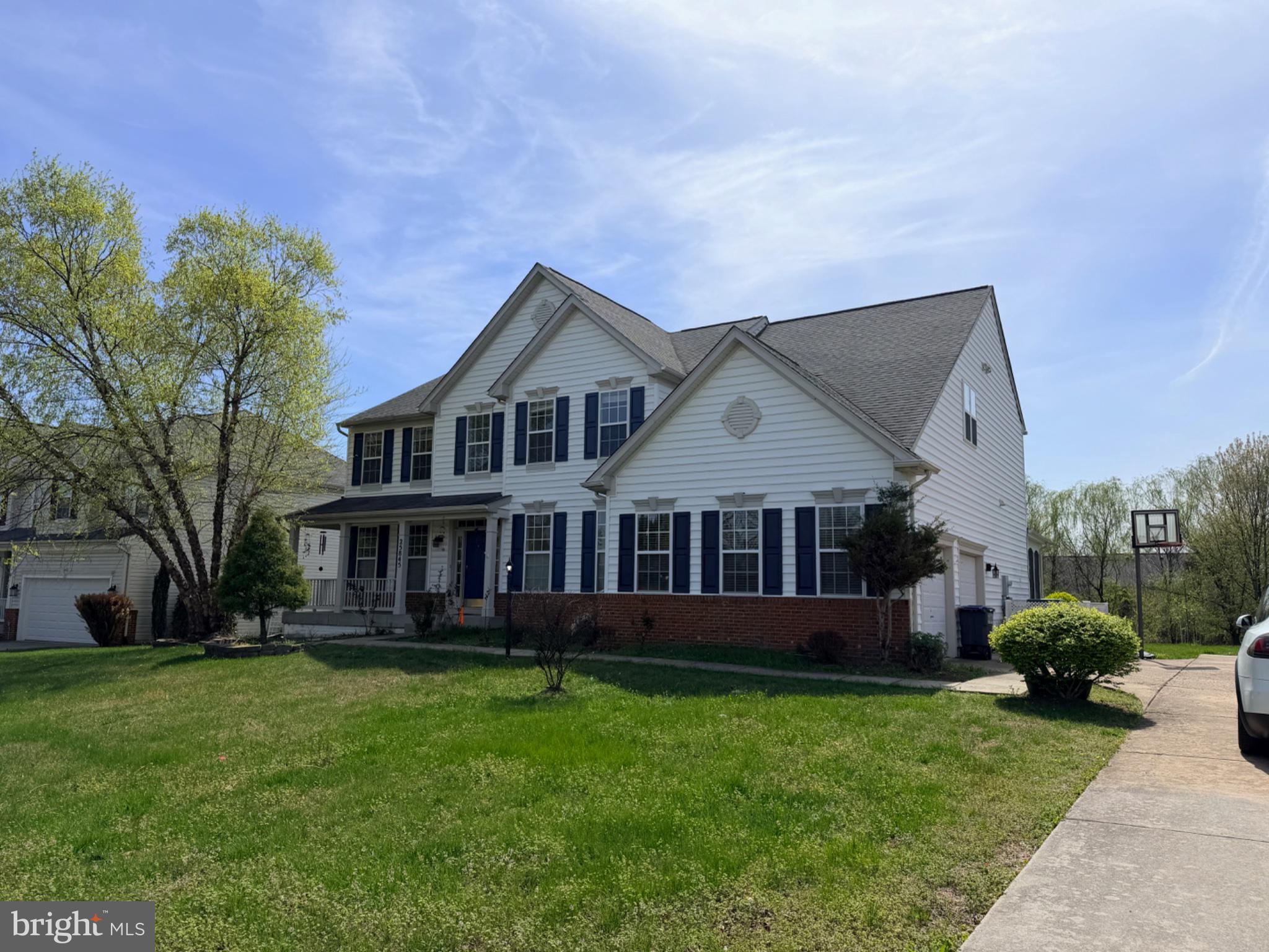 Charming suburban home with lush lawn.