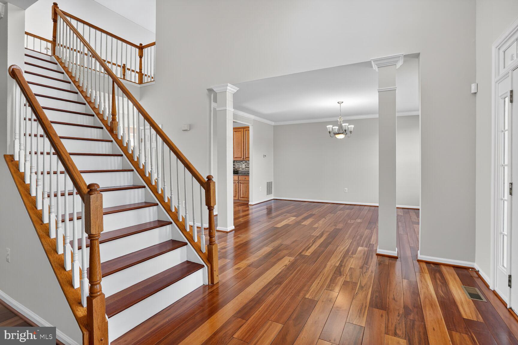 25845 Spring Farm Circle Chantilly, VA 20152 - Photo 9 of 57 Elegant entryway with rich hardwood floors.