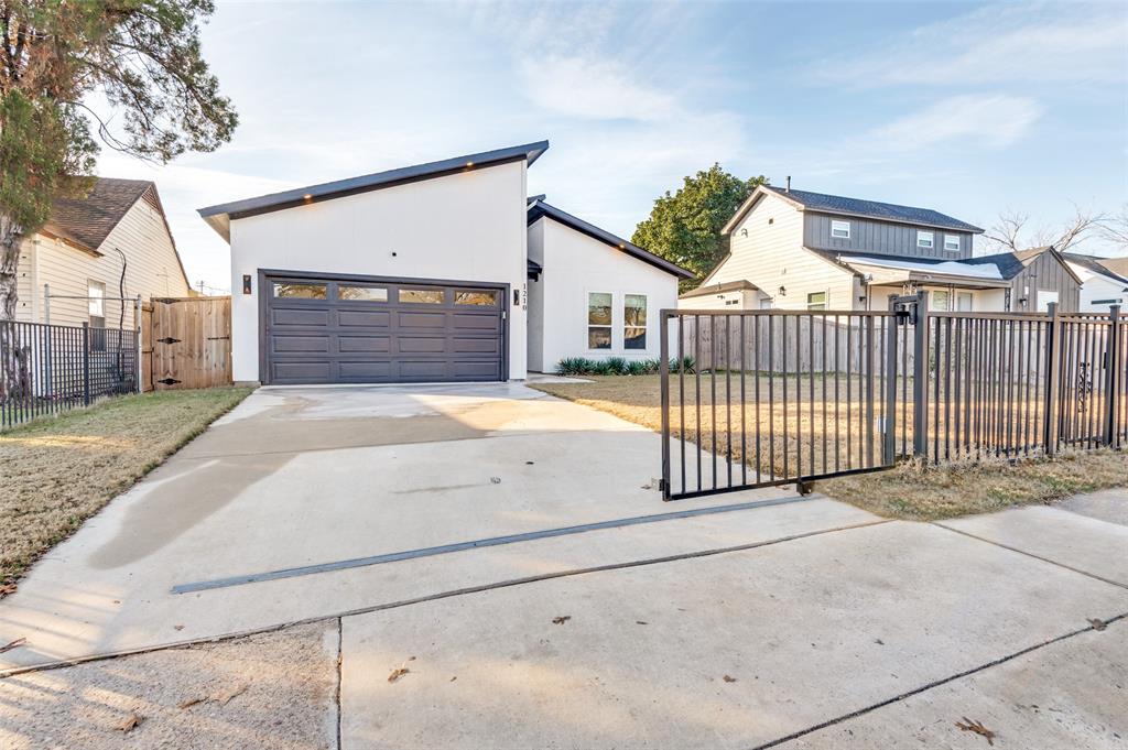 1210 Morrell Avenue Dallas, TX 75203 - Photo 2 of 28 a view of a house with a small yard and plants