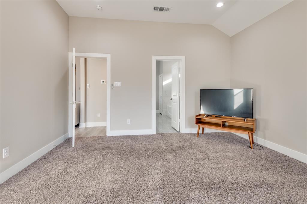 1210 Morrell Avenue Dallas, TX 75203 - Photo 22 of 28 an empty room with a flat screen tv and couches