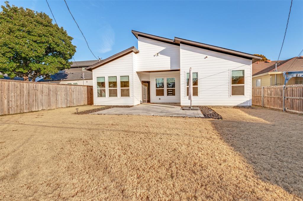 1210 Morrell Avenue Dallas, TX 75203 - Photo 25 of 28 a front view of a house with a yard