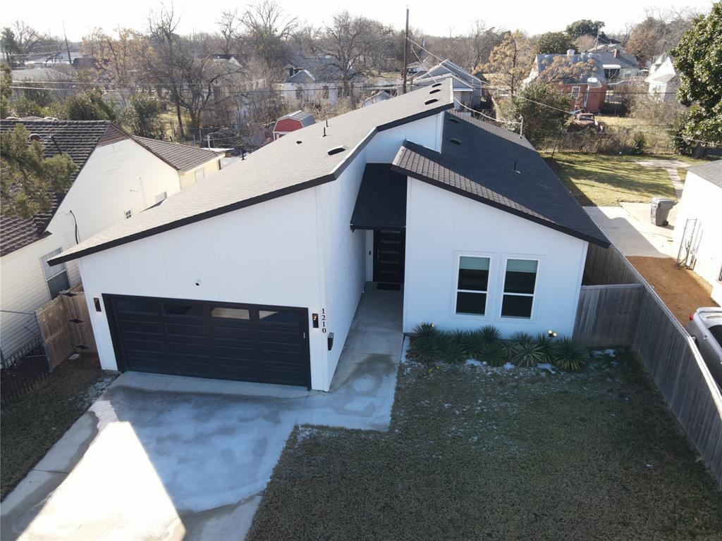 1210 Morrell Avenue Dallas, TX 75203 - Photo 27 of 28 a view of a house with a backyard