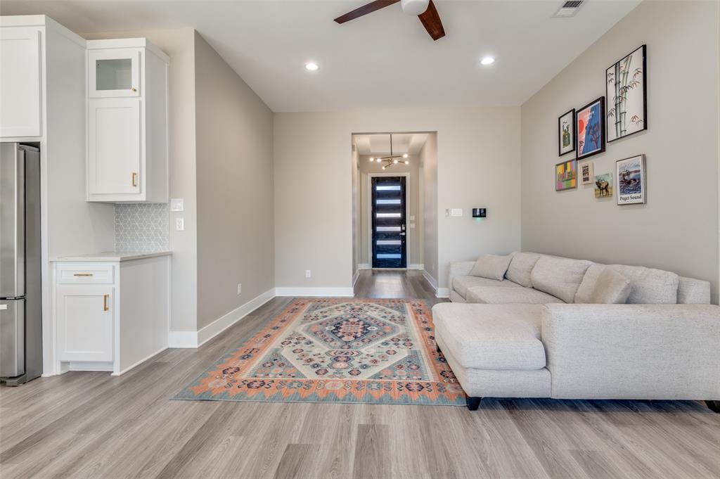 1210 Morrell Avenue Dallas, TX 75203 - Photo 5 of 28 a living room with furniture and a wooden floor