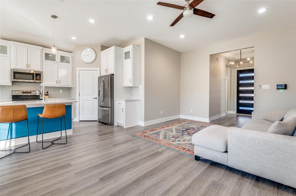 1210 Morrell Avenue Dallas, TX 75203 - Photo 8 of 28 a living room with furniture and kitchen view