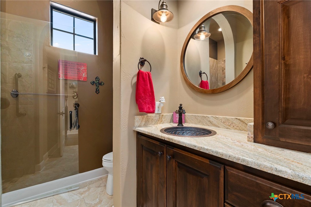 1039 Bluewater Place Spring Branch, TX 78070 - Photo 31 of 48 a bathroom with a sink and a mirror
