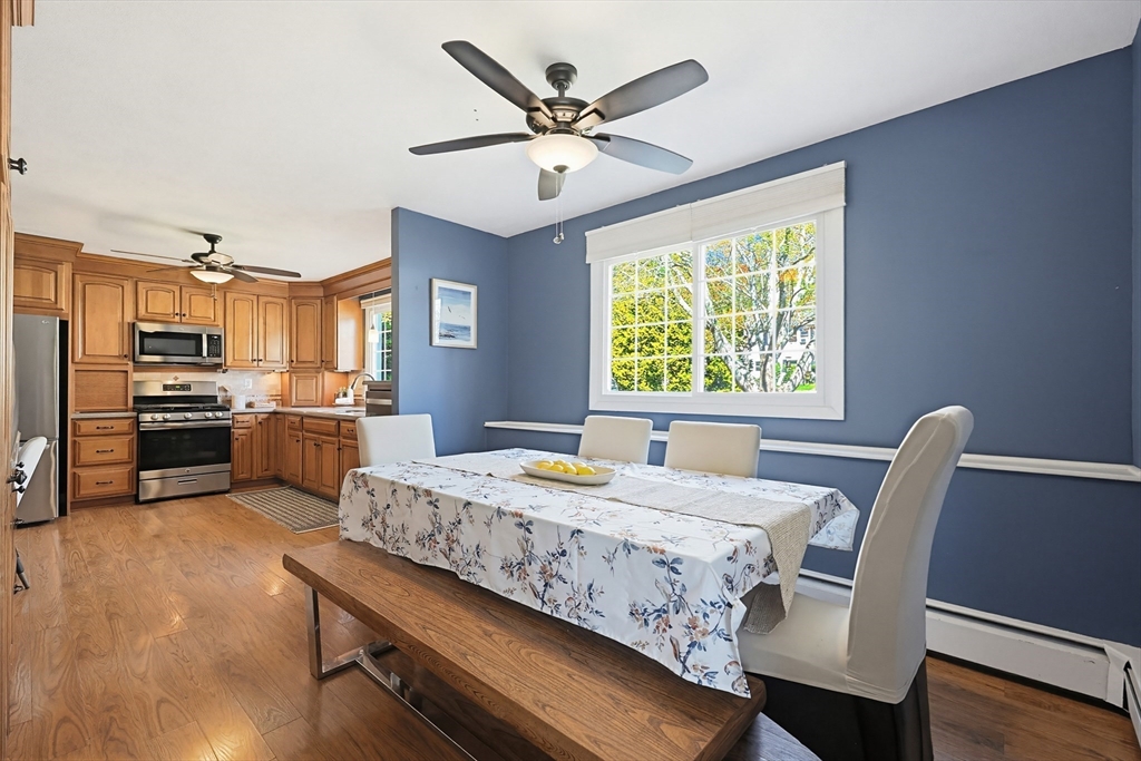 18 Anchorage Road Franklin, MA 02038 - Photo 12 of 42 a dining room with a table chairs and a kitchen view