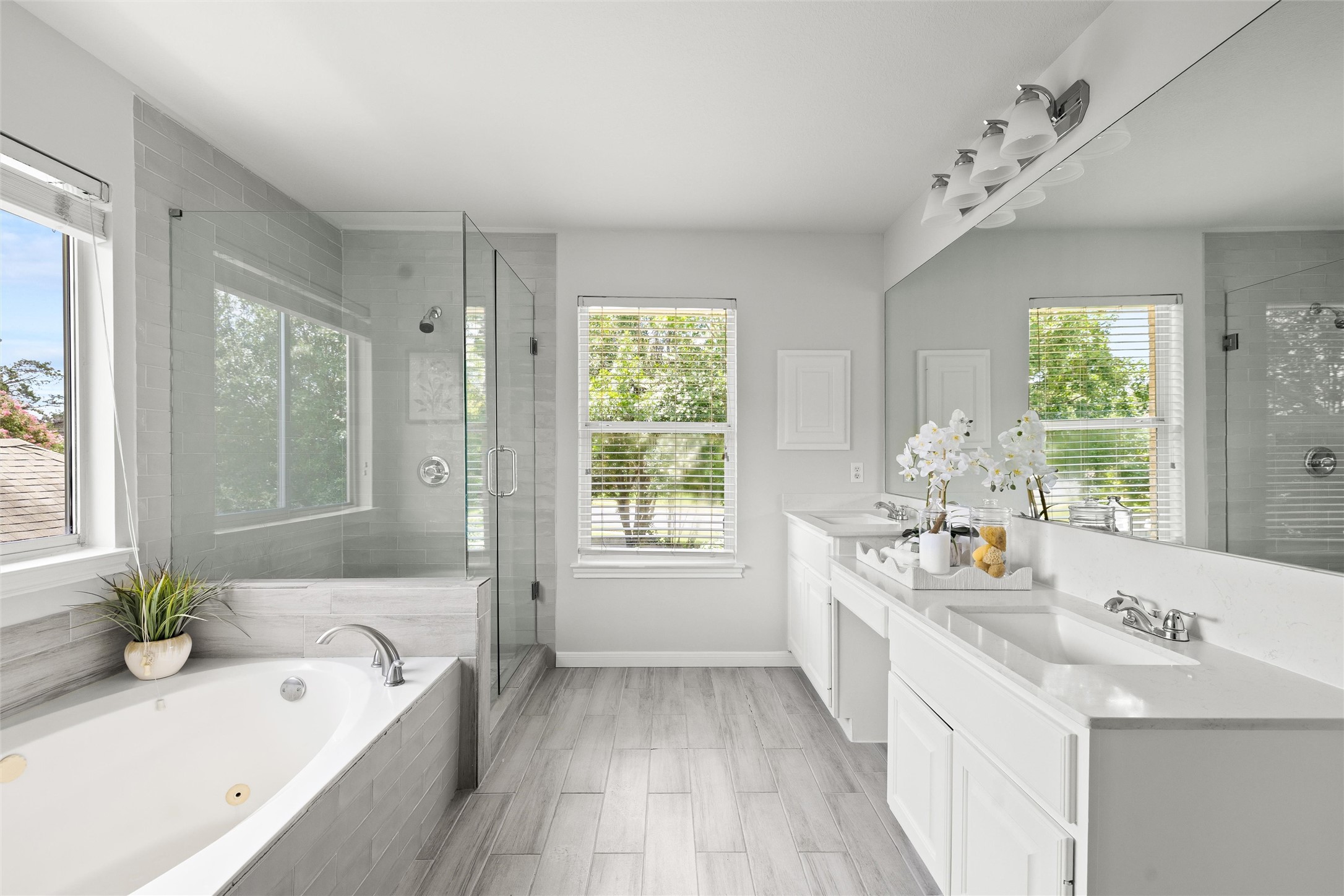 3416 Oxsheer Drive Austin, TX 78732 - Photo 21 of 39 Beautifully remodeled primary bathroom with walk-in shower, soaking tub and dual sinks