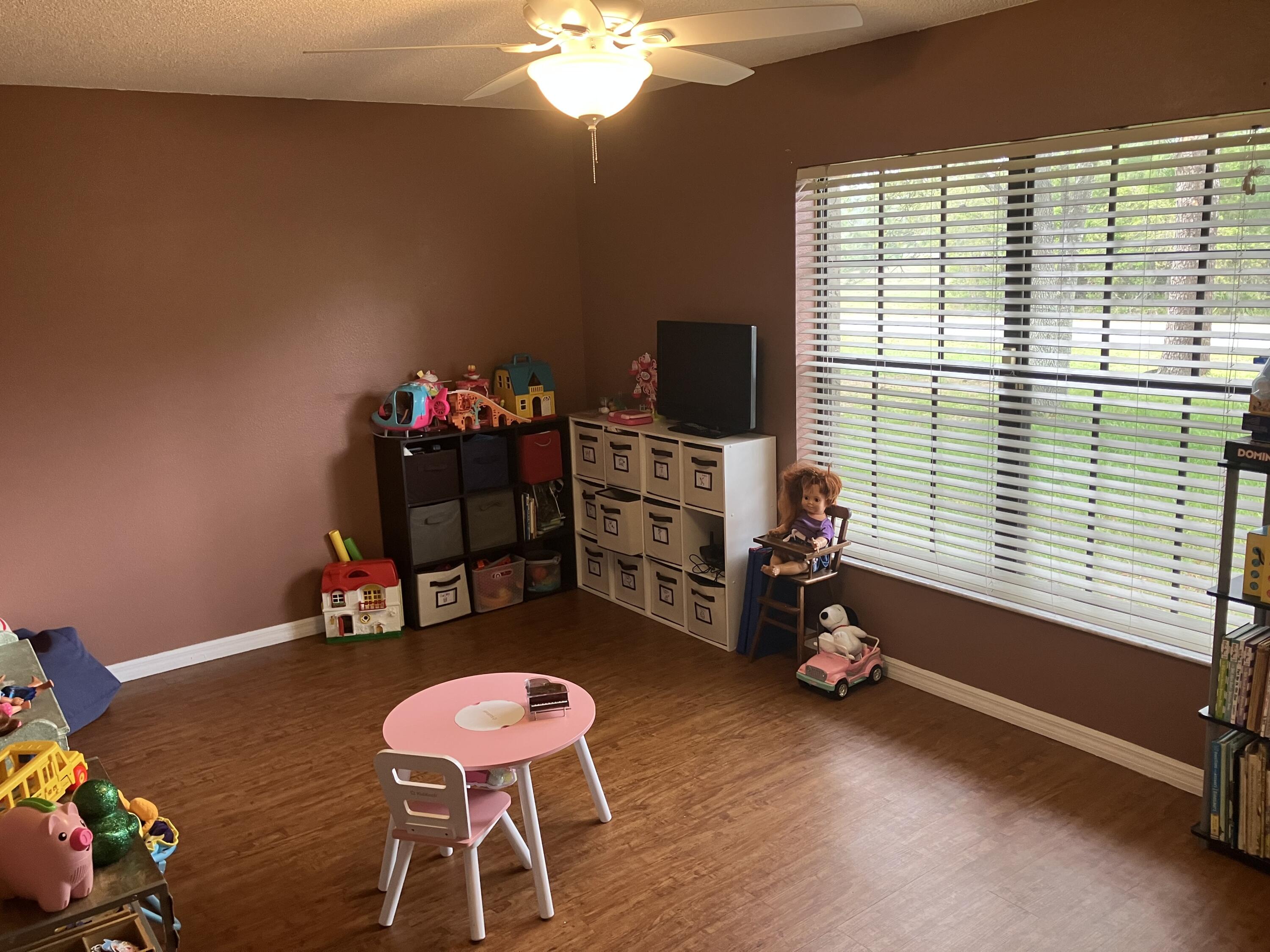 14050 Brighton Street Spring Hill, FL 34609 - Photo 13 of 20 a room with toys and a large window