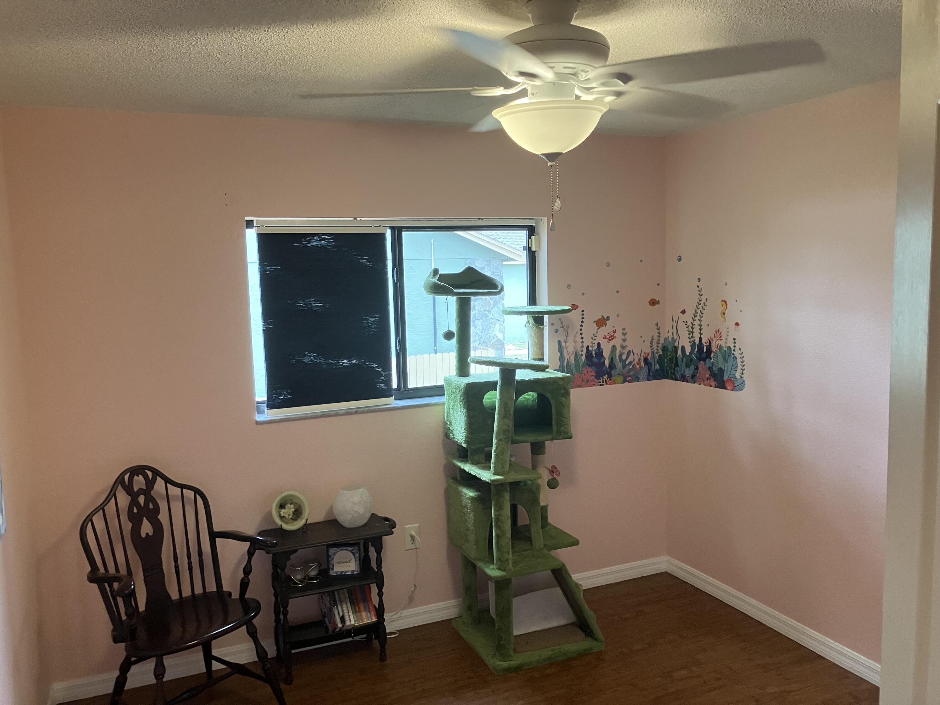 14050 Brighton Street Spring Hill, FL 34609 - Photo 14 of 20 a view of a dining room with furniture and a chandelier fan