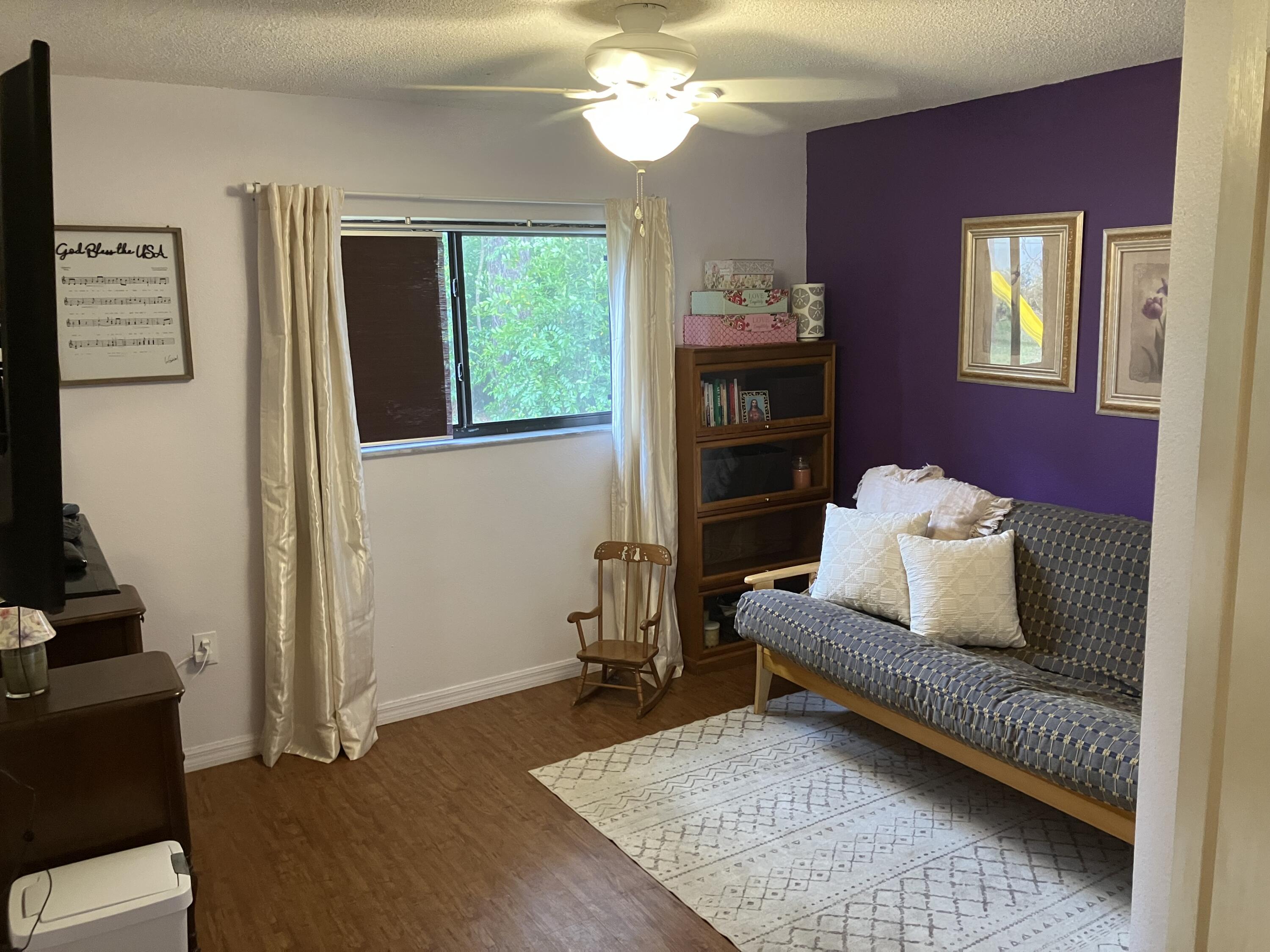14050 Brighton Street Spring Hill, FL 34609 - Photo 15 of 20 a living room with furniture and a chandelier