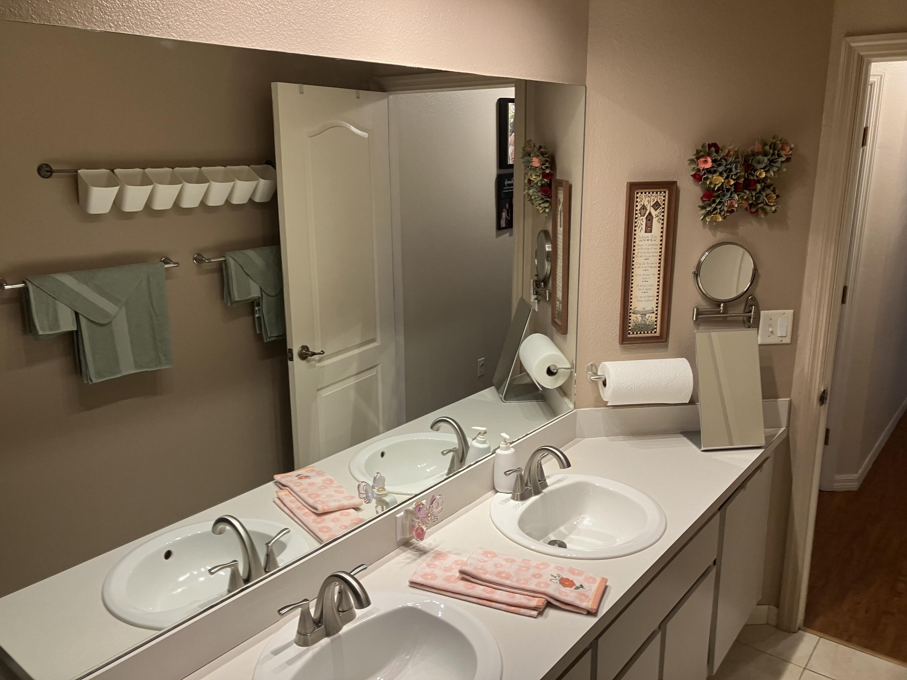 14050 Brighton Street Spring Hill, FL 34609 - Photo 17 of 20 a bathroom with a sink double vanity and a mirror