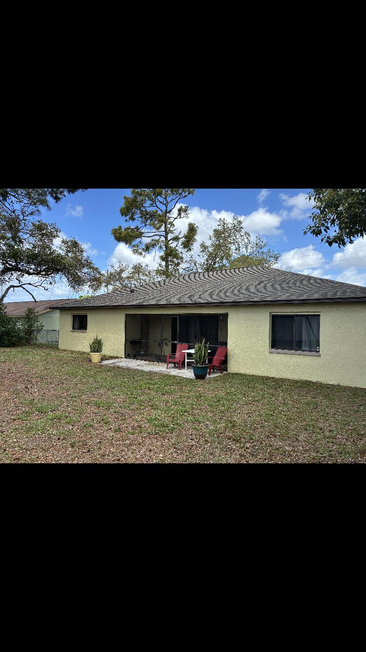 14050 Brighton Street Spring Hill, FL 34609 - Photo 20 of 20 a view of a wooden deck