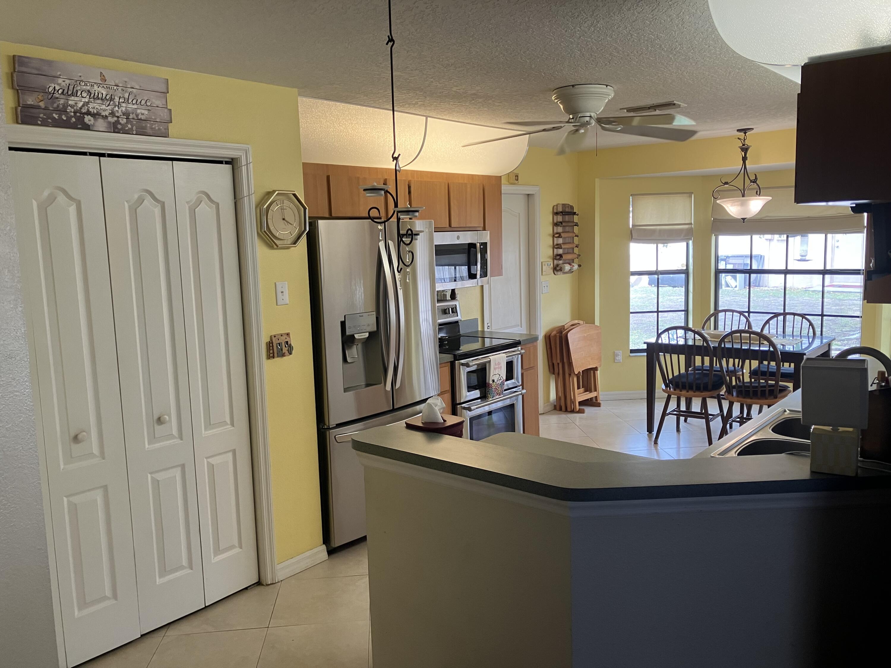 14050 Brighton Street Spring Hill, FL 34609 - Photo 5 of 20 a view of a dining area with furniture window and outside view