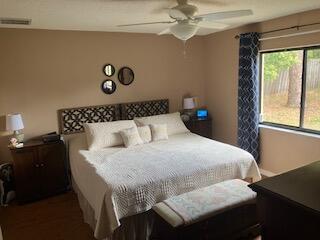 14050 Brighton Street Spring Hill, FL 34609 - Photo 9 of 20 a bedroom with a bed and a window