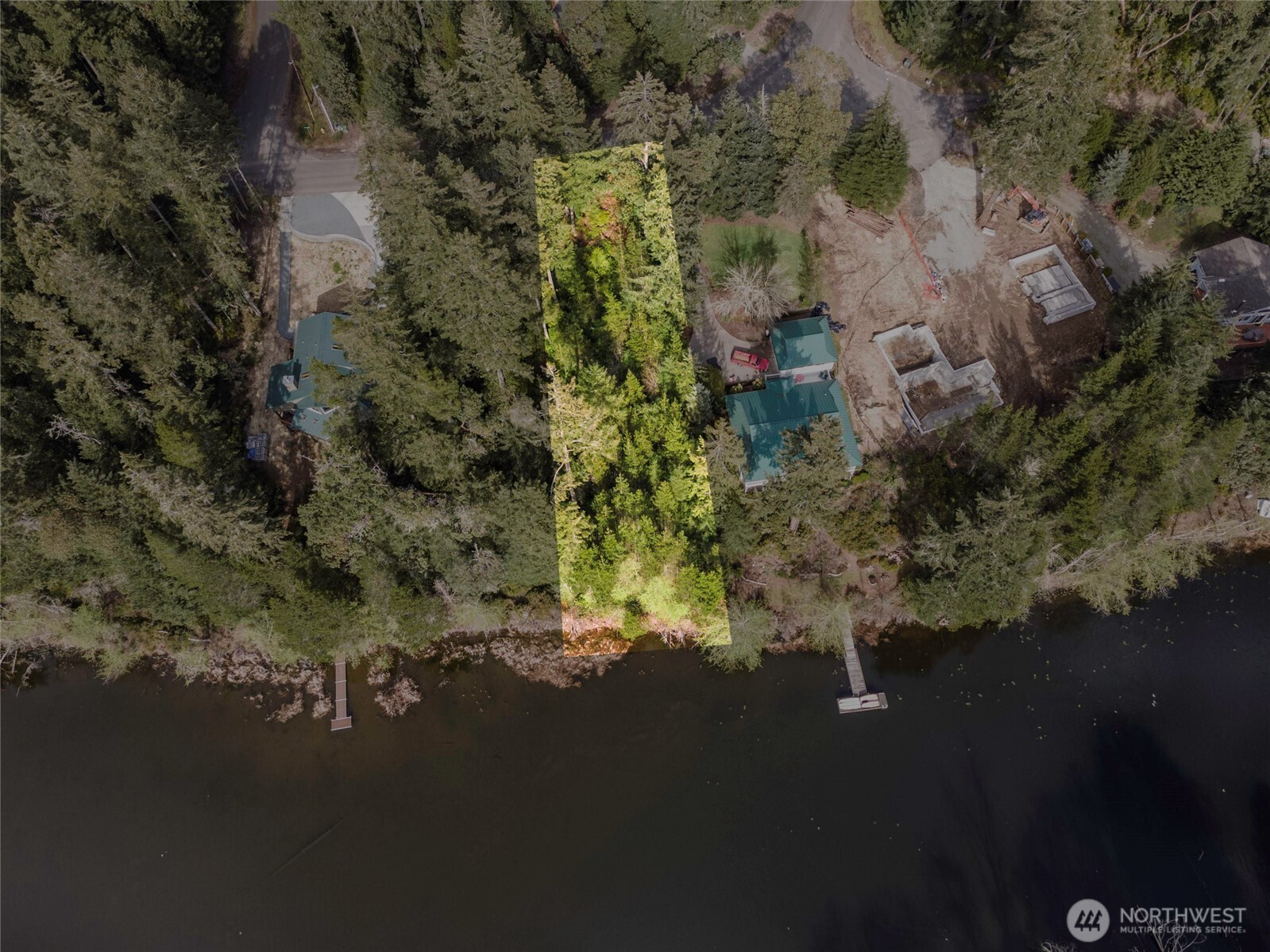 11018 Matthews Way Anderson Island, WA 98303 - Photo 1 of 19 an aerial view of a house with a yard