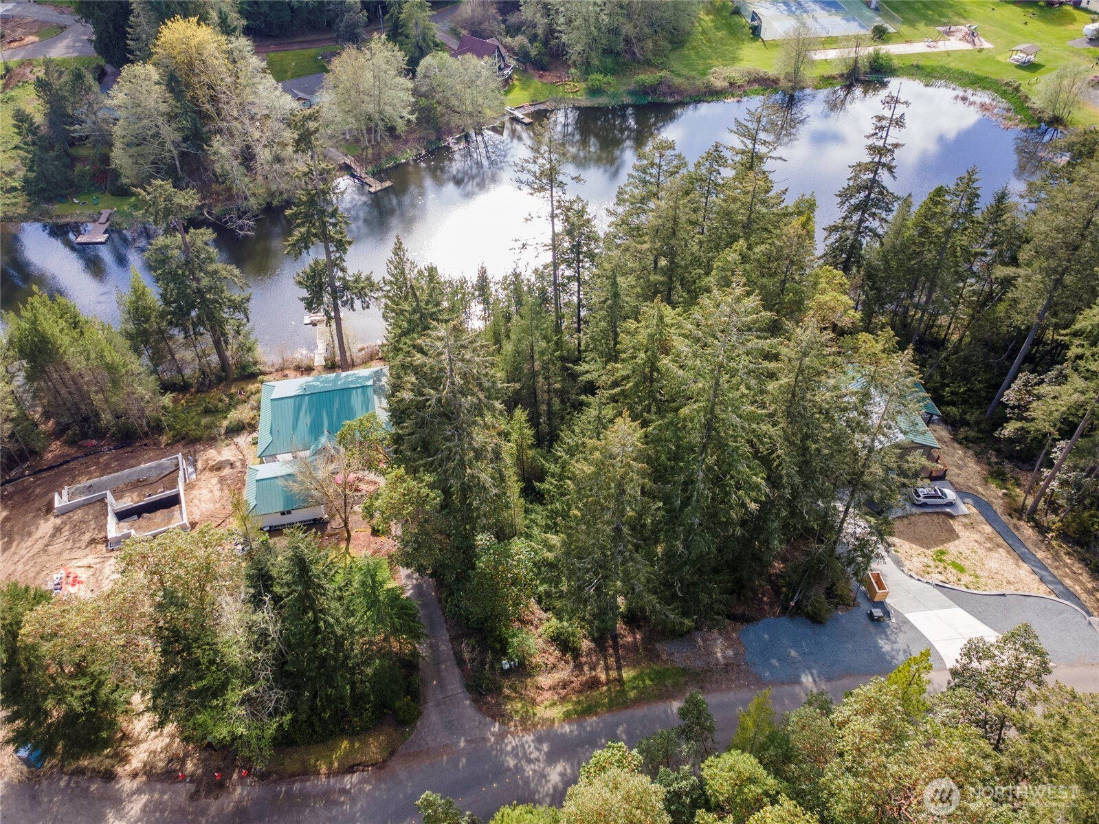 11018 Matthews Way Anderson Island, WA 98303 - Photo 6 of 19 a aerial view of a house with a yard and lake view