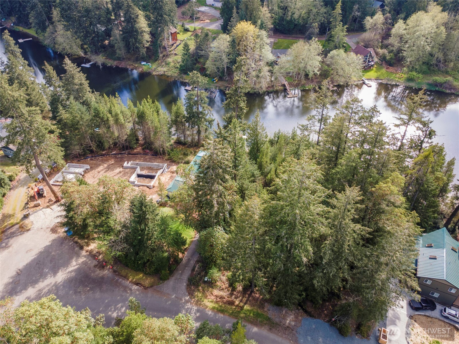 11018 Matthews Way Anderson Island, WA 98303 - Photo 7 of 19 a backyard of a house with a yard with outdoor seating