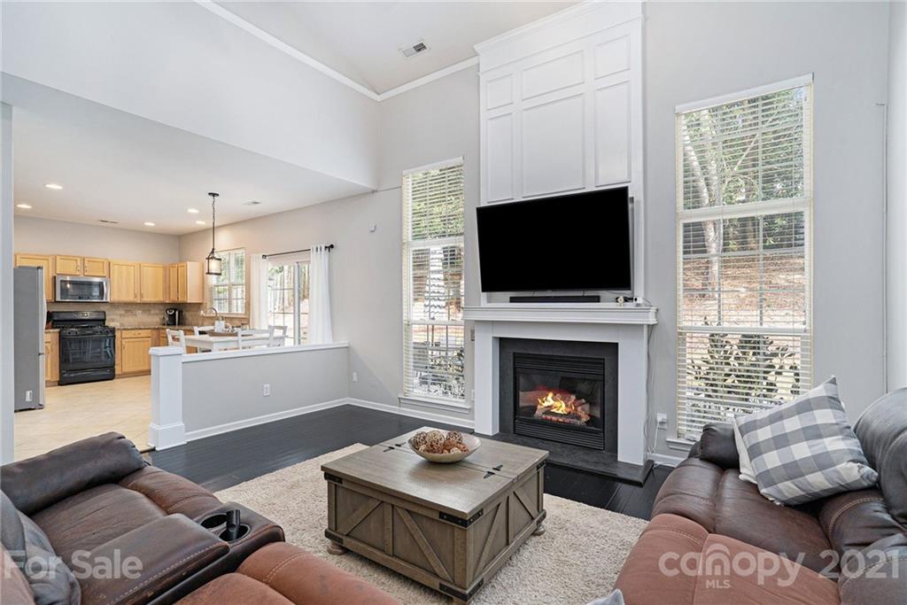 9379 Hillston Ridge Road Huntersville, NC 28078 - Photo 16 of 38 a living room with furniture and a fireplace