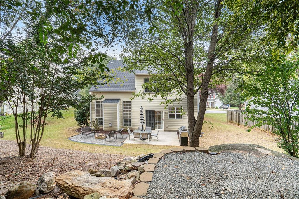 9379 Hillston Ridge Road Huntersville, NC 28078 - Photo 32 of 38 a front view of a house with garden